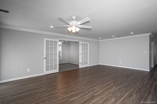 69 Overlook Drive, Unit 69 Farmingville, NY 11738 - Photo 6 of 16 a view of an empty room with wooden floor and a ceiling fan