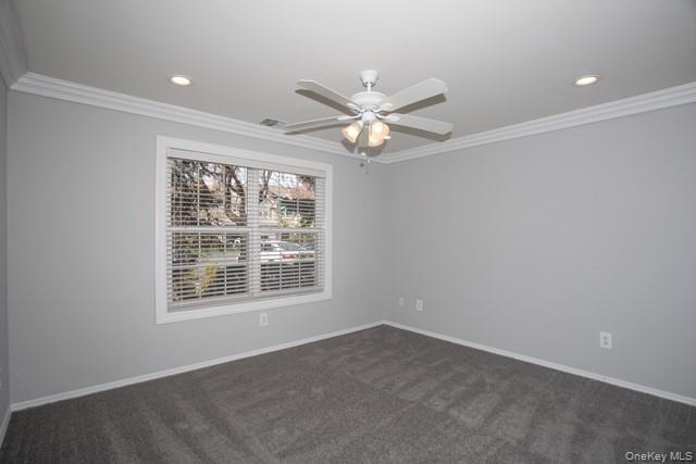 69 Overlook Drive, Unit 69 Farmingville, NY 11738 - Photo 9 of 16 an empty room with a window and a fan