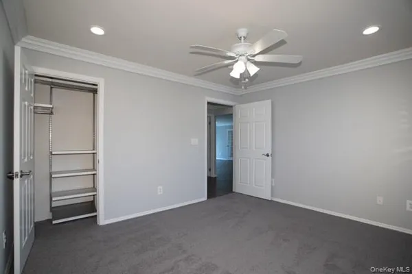 a view of a livingroom with a ceiling fan