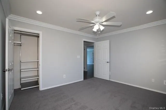 a view of a livingroom with a ceiling fan