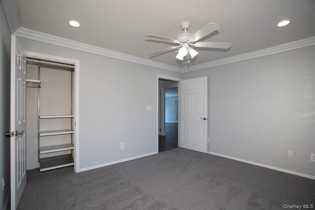 69 Overlook Drive, Unit 69 Farmingville, NY 11738 - Photo 10 of 16 a view of a livingroom with a ceiling fan