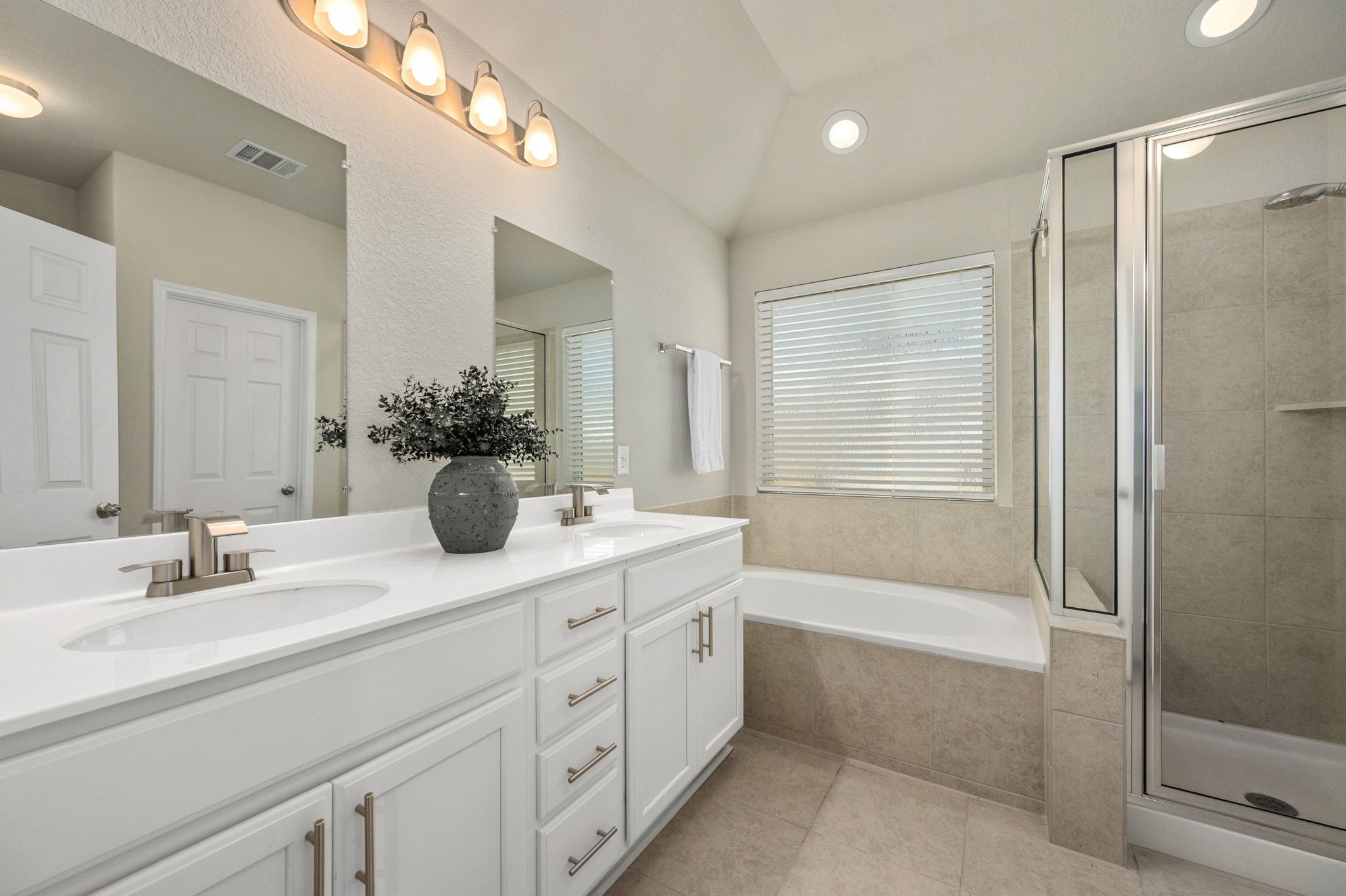 109 Findley Avenue Leander, TX 78641 - Photo 15 of 38 The primary bath offers an oversized double vanity with both cabinet AND drawer space.