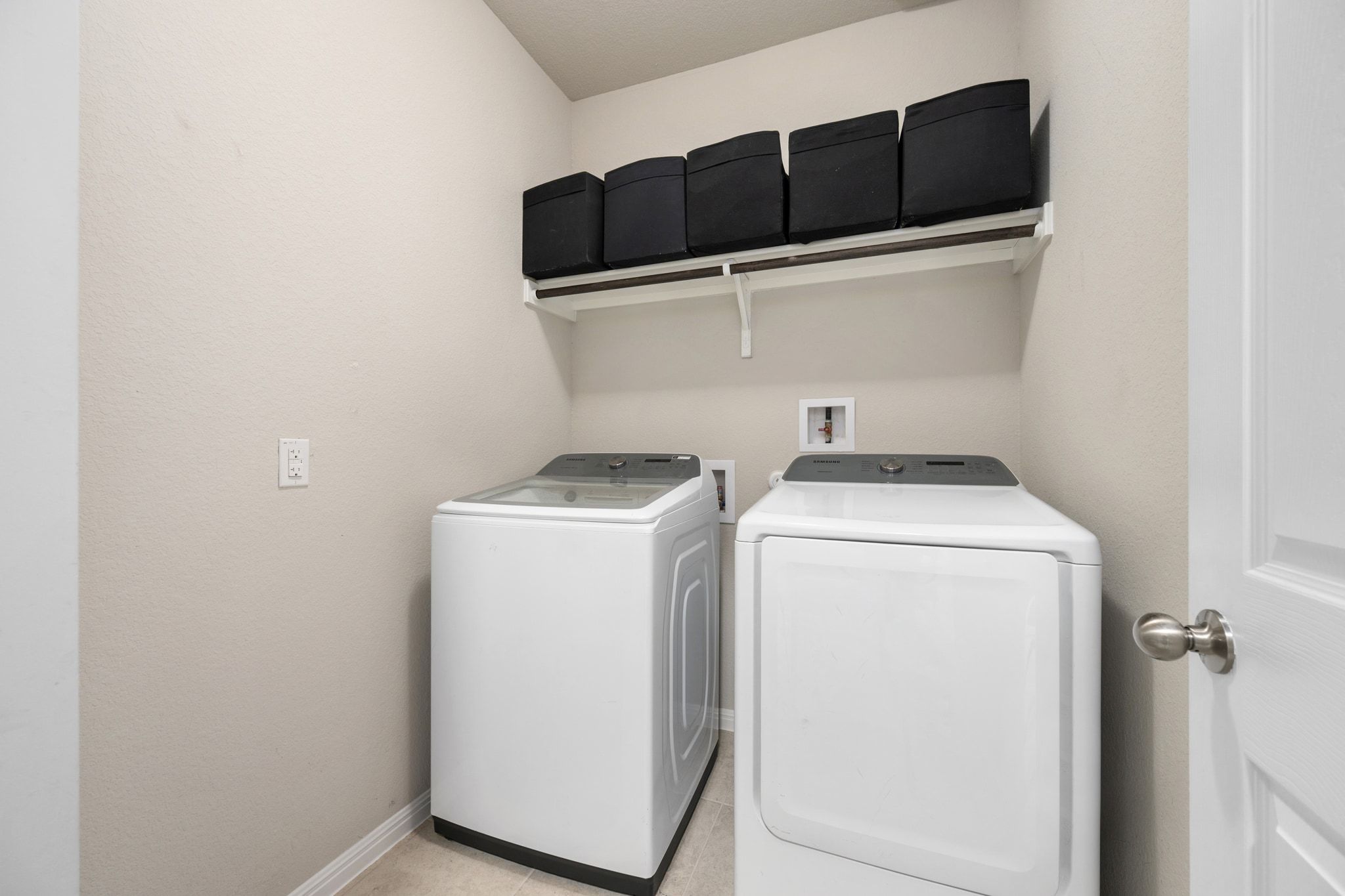 109 Findley Avenue Leander, TX 78641 - Photo 23 of 38 A well-placed laundry room next to the three secondary bedrooms