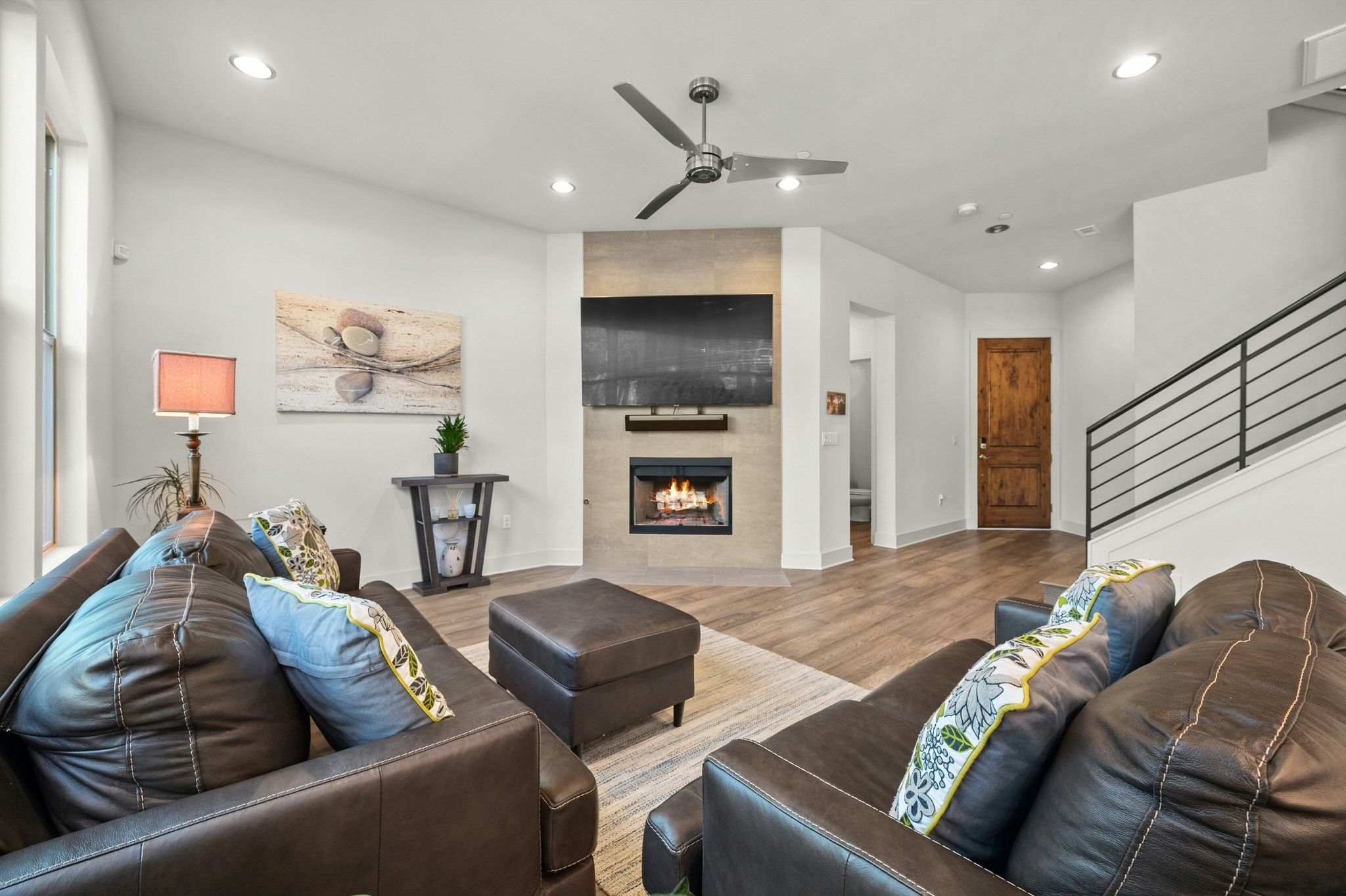 8110 Ranch Road 2222, Unit 92 Austin, TX 78730 - Photo 5 of 40 Living area featuring a floor-to-ceiling tiled fireplace surround, an electric fireplace, and recessed lighting