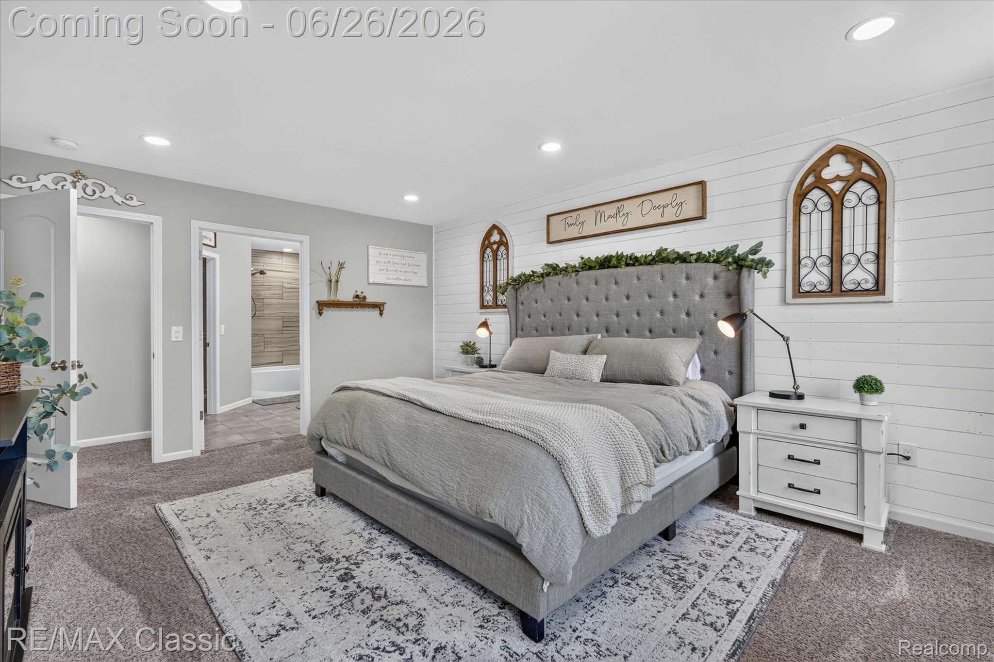 3205 North Milford Road Highland, MI 48357 - Photo 17 of 53 Bedroom featuring recessed lighting, shiplap accent wall, carpeting, and an ensuite bathroom entry with tiled shower