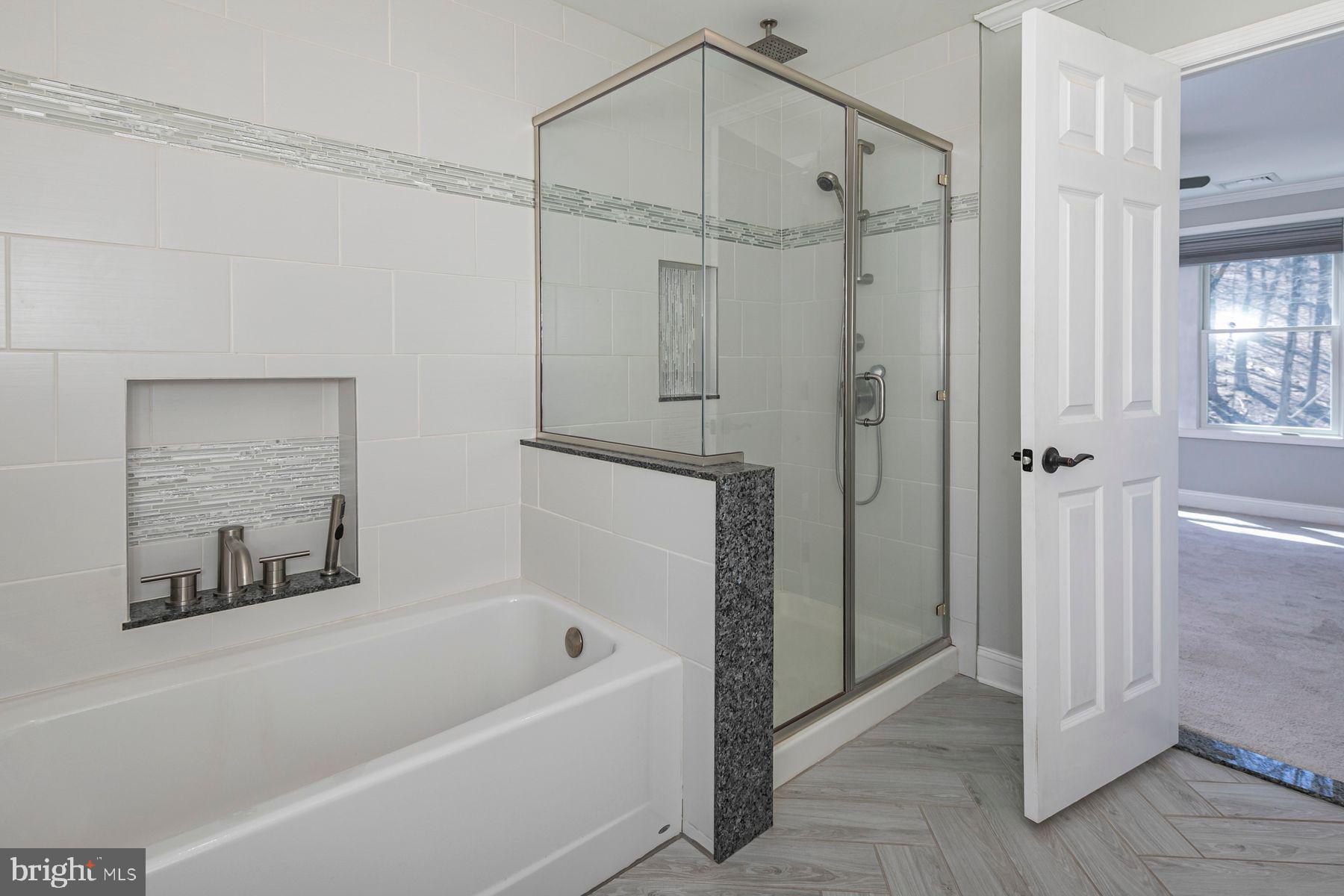 310 Hollow Road Skillman, NJ 08558 - Photo 20 of 32 a bathroom with a bathtub and a shower