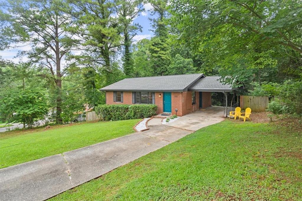 2292 Boulder Road Southeast Atlanta, GA 30316 - Photo 1 of 1 a front view of a house with a garden and porch