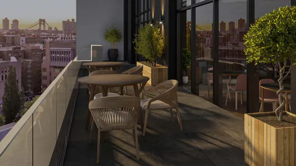 a balcony with table and chairs