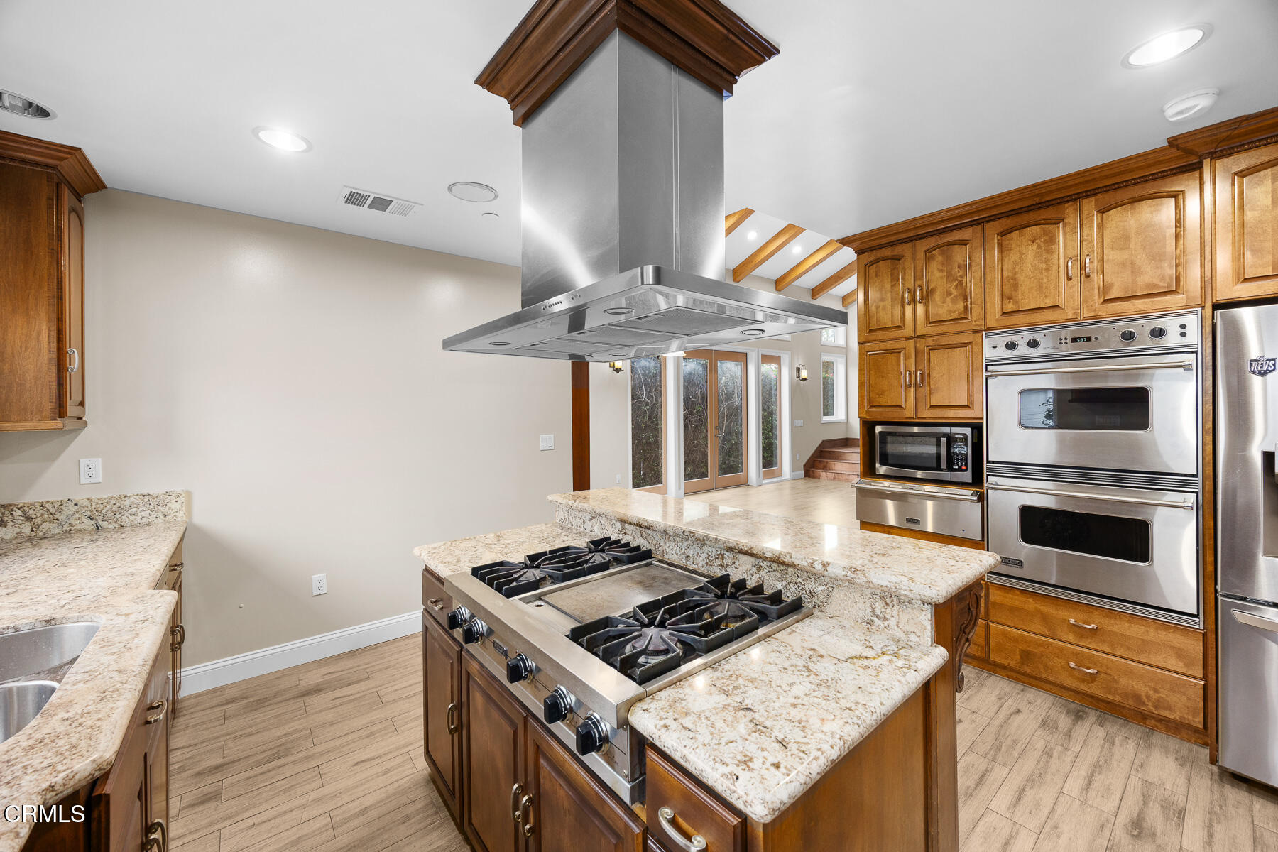 450 Allendale Road Pasadena, CA 91106 - Photo 22 of 57 a kitchen with stainless steel appliances granite countertop a stove and a refrigerator