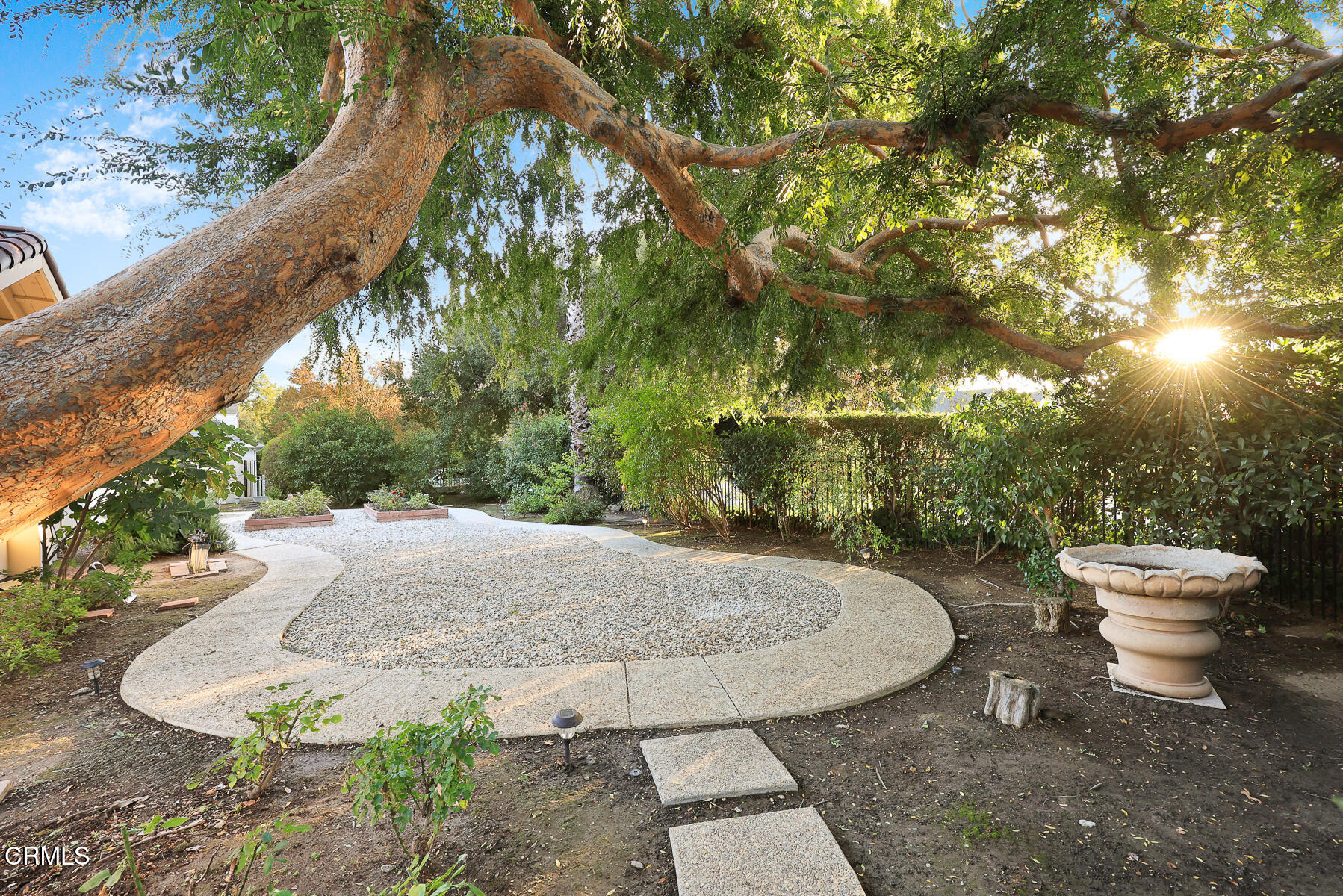 450 Allendale Road Pasadena, CA 91106 - Photo 48 of 57 a view of a fountain in the backyard of a house