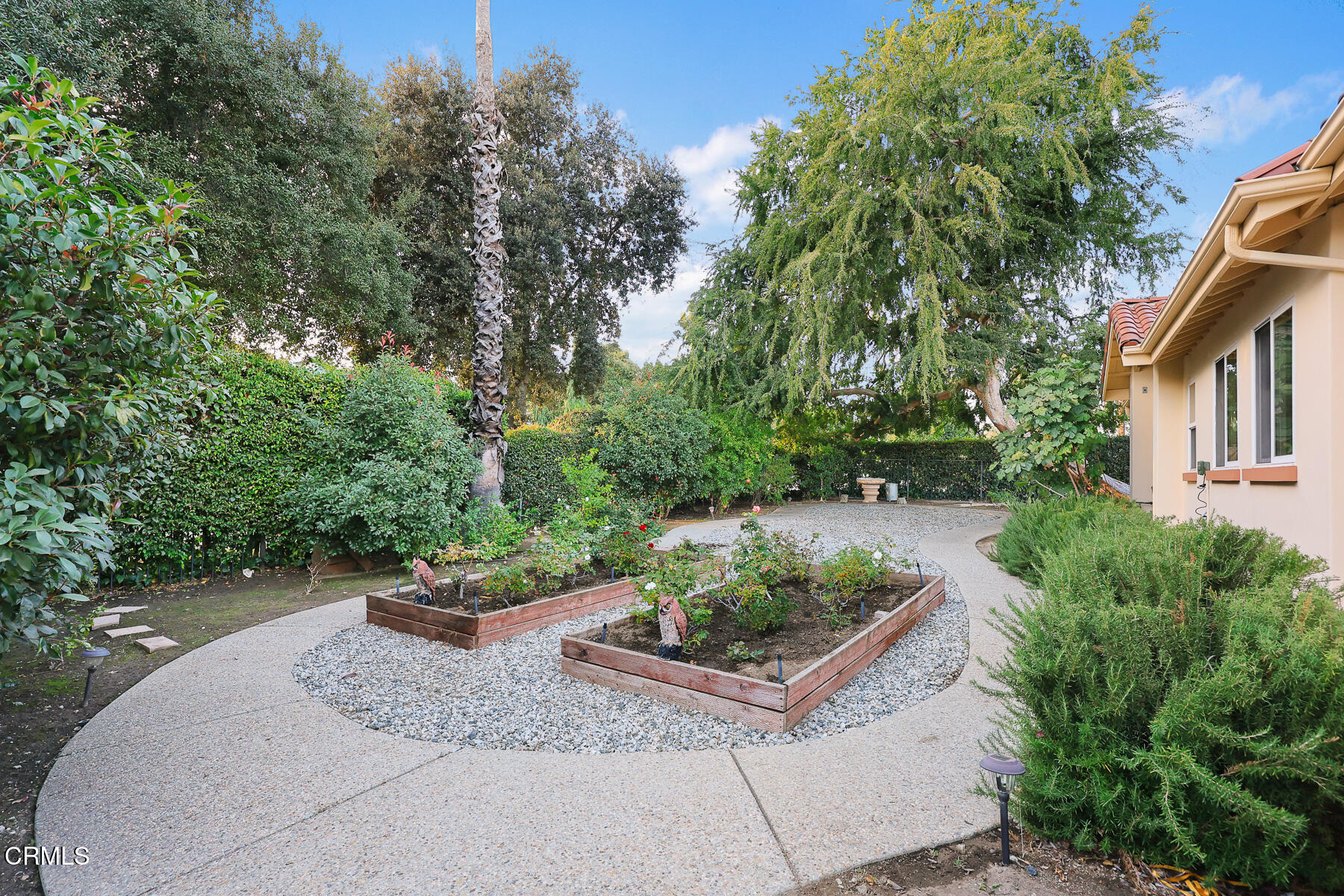 450 Allendale Road Pasadena, CA 91106 - Photo 51 of 57 a view of a backyard with table and chairs potted plants and large tree