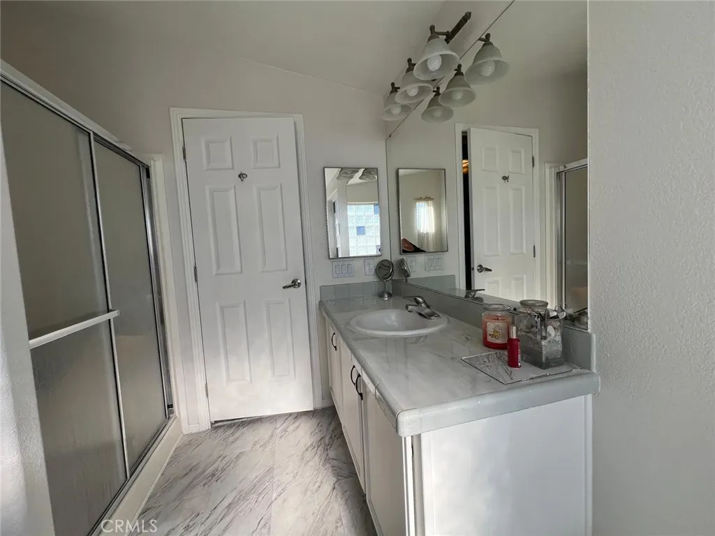 10550 Western, Unit 43 Stanton, CA 90680 - Photo 13 of 27 a bathroom with a sink and a mirror