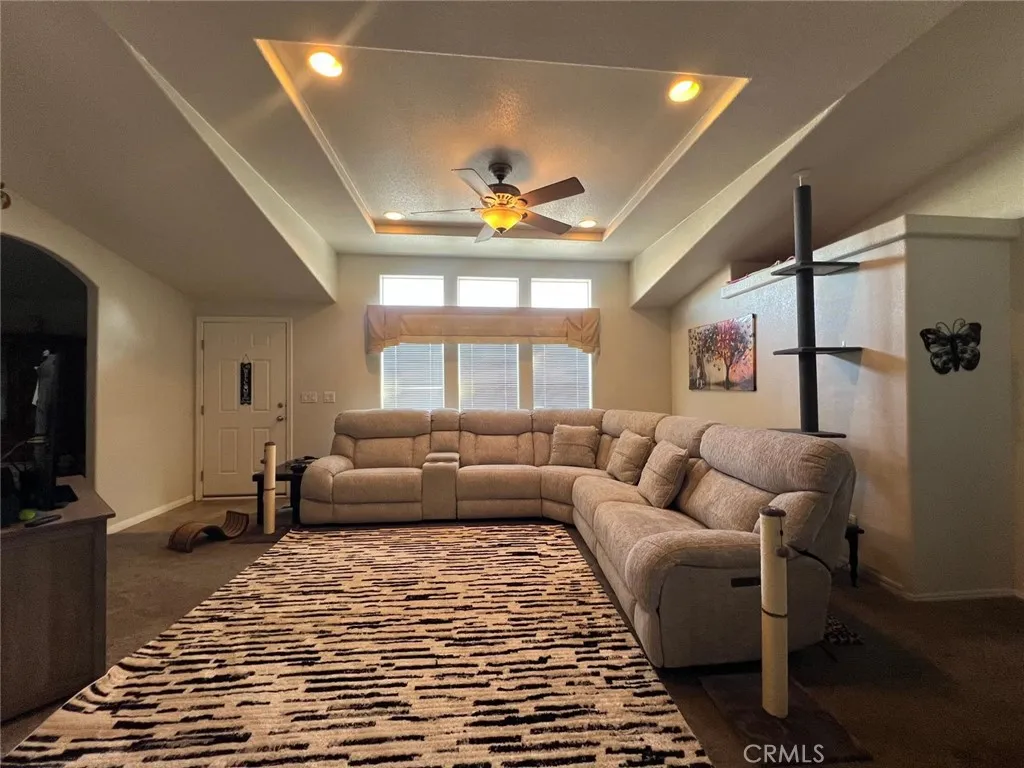10550 Western, Unit 43 Stanton, CA 90680 - Photo 17 of 27 a living room with furniture a chandelier and a rug