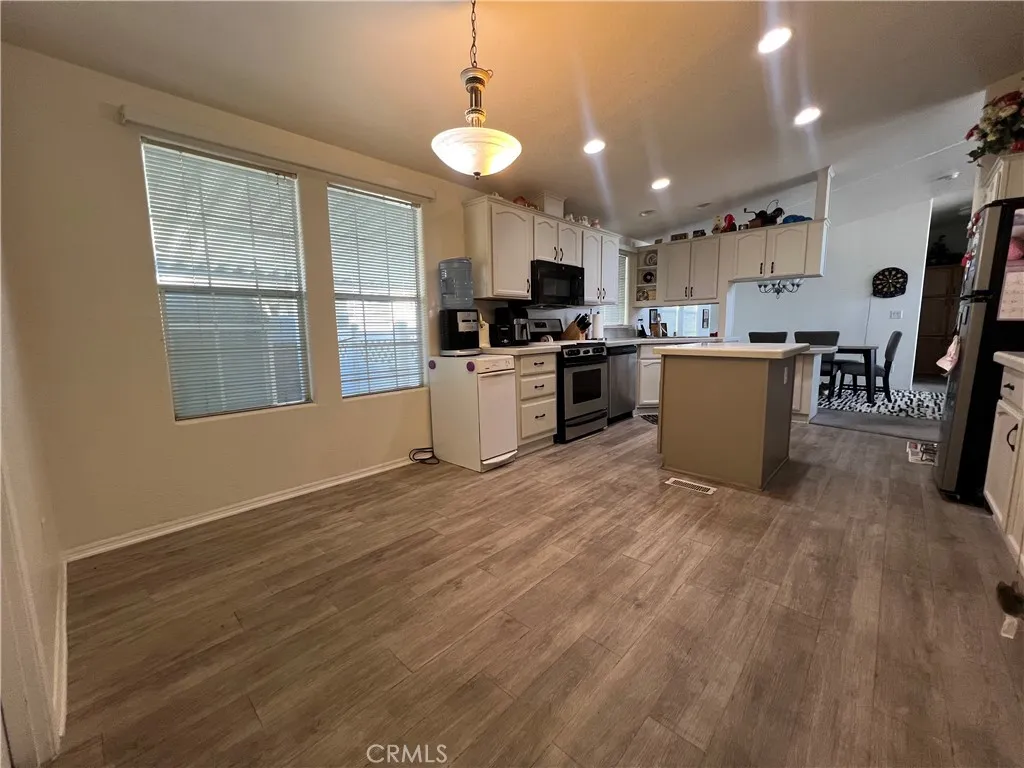 10550 Western, Unit 43 Stanton, CA 90680 - Photo 21 of 27 a kitchen with furniture and a wooden floor