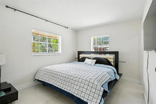 a view of a dining room with furniture and window