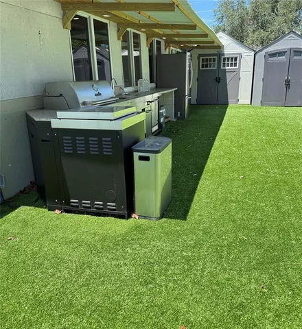 a kitchen that has a sink and a stove