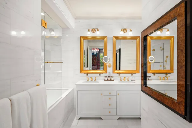 a bed room with a bed and a chandelier