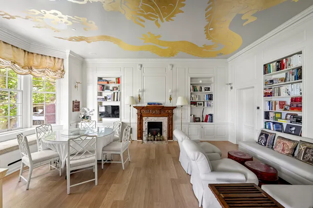 a bathroom with a double vanity sink mirror and bathtub