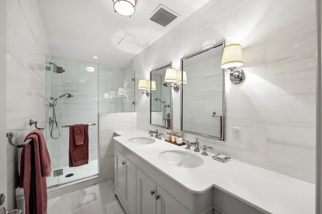 a living room with furniture fireplace and a large window
