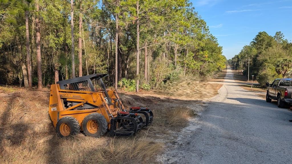 Southwest 53rd Street Ocala, FL 34481 - Photo 3 of 13 a view of a car is parked in a yard