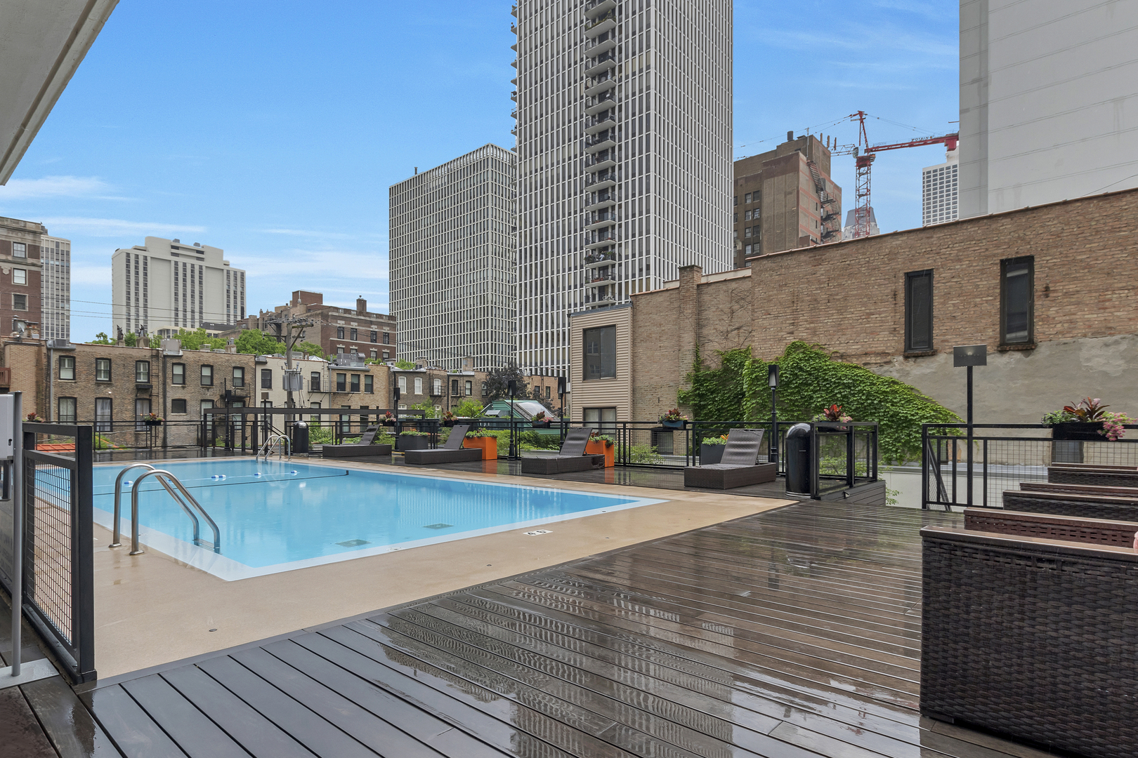 21 West Goethe Street, Unit 14D Chicago, IL 60610 - Photo 21 of 28 a view of a swimming pool with seating space