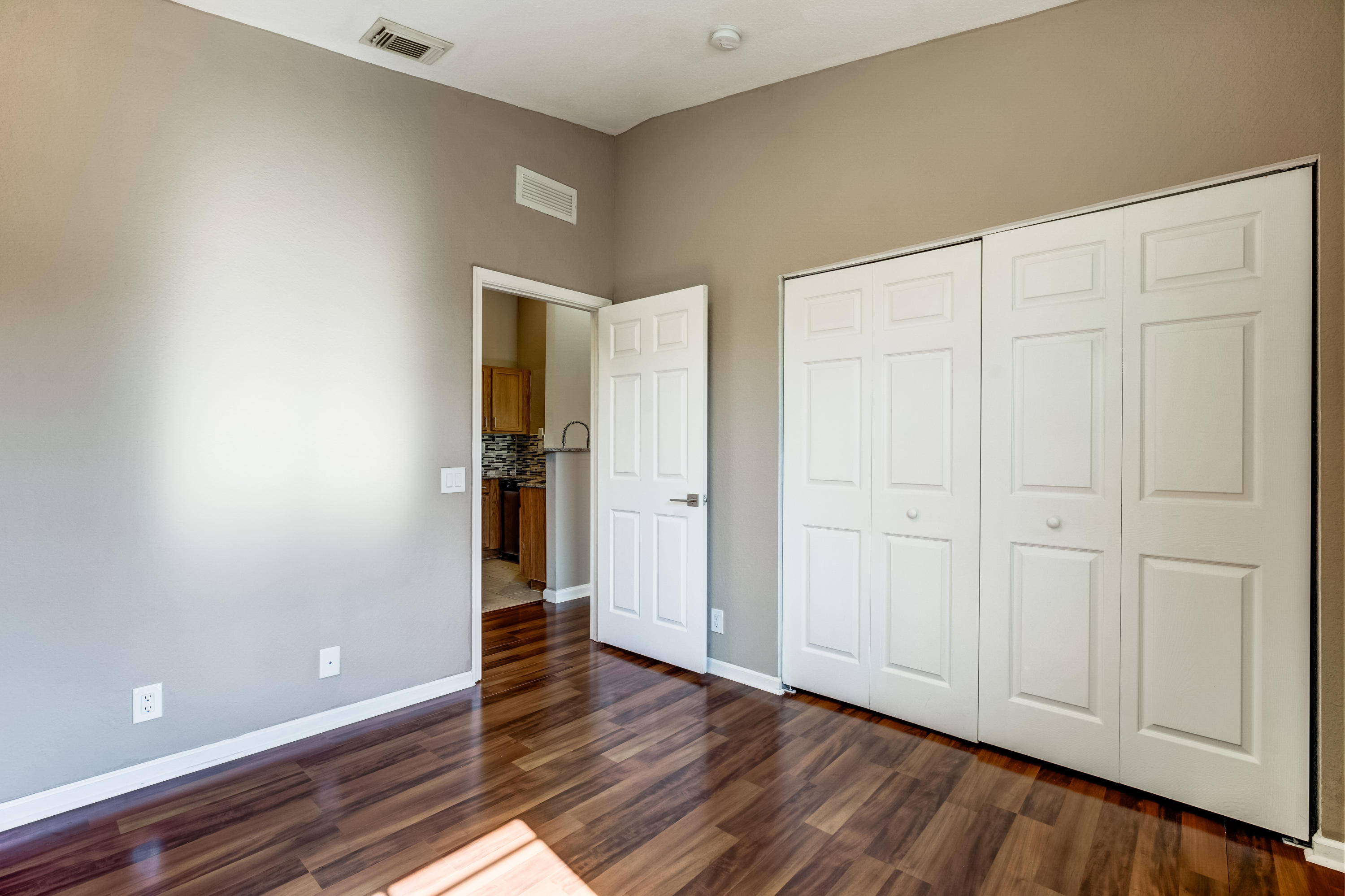 3174 Laurel Ridge Circle Riviera Beach, FL 33404 - Photo 10 of 32 a view of empty room with wooden floor