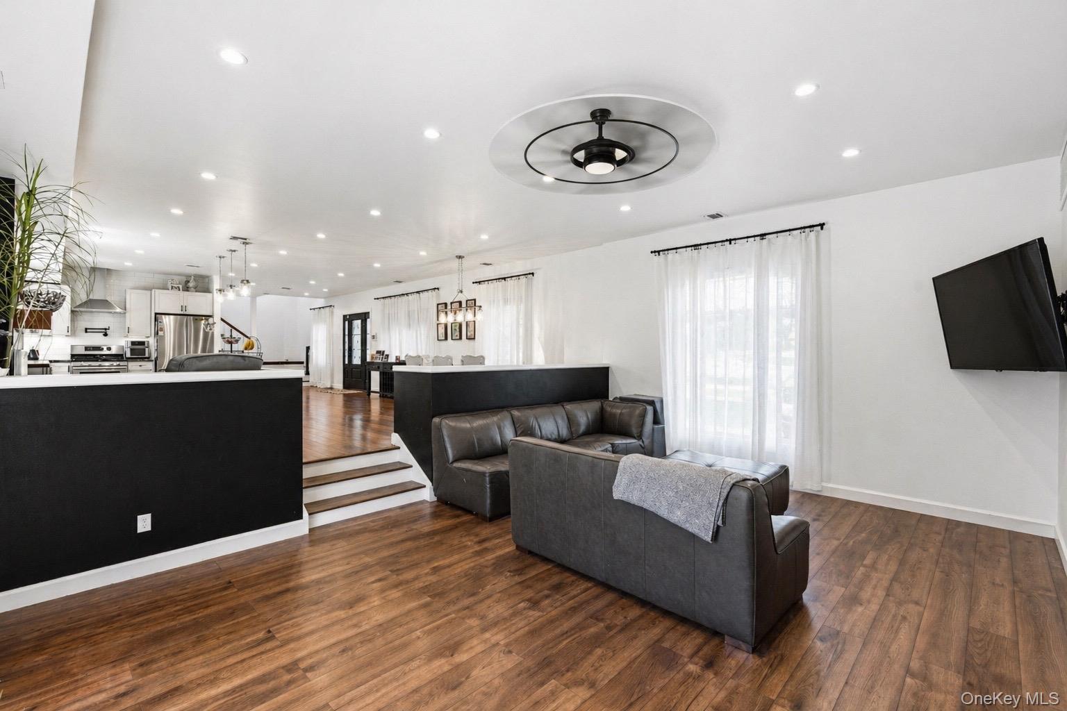 18 Pond Road Holbrook, NY 11741 - Photo 11 of 41 Living space with wood-finish flooring and recessed lighting