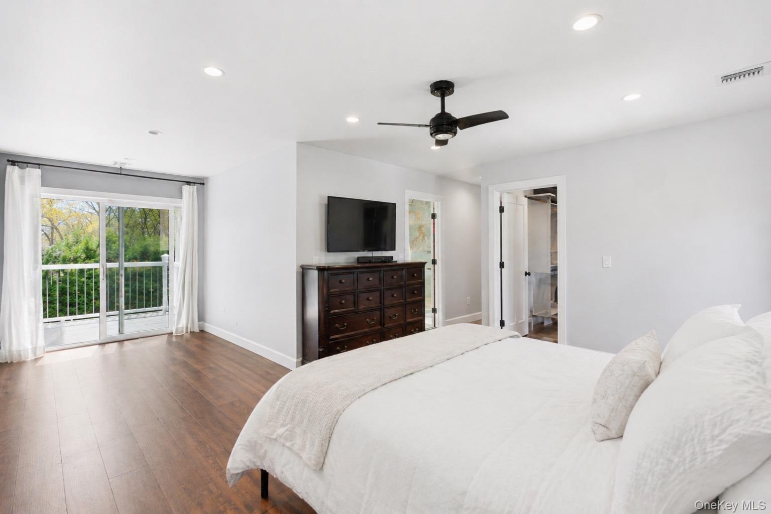 18 Pond Road Holbrook, NY 11741 - Photo 20 of 41 Spacious Primary Bedroom featuring wood-finish flooring and a private balcony with white railings