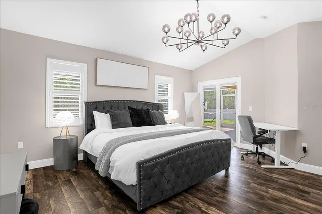 a bedroom with bed and window