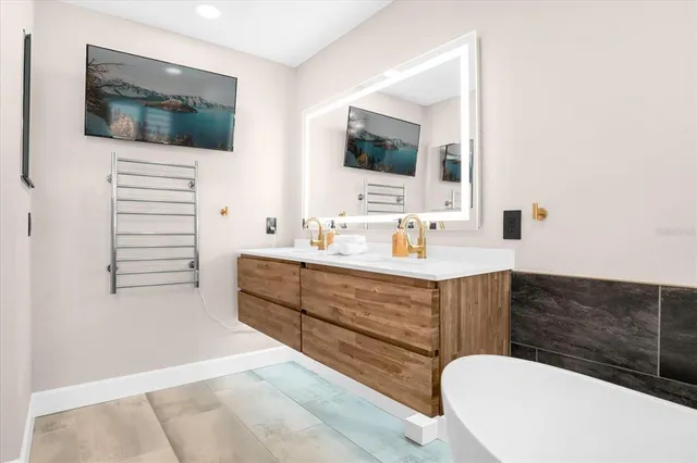 a bathroom with a sink a mirror and a toilet