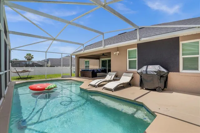 a balcony with furniture and a potted plant