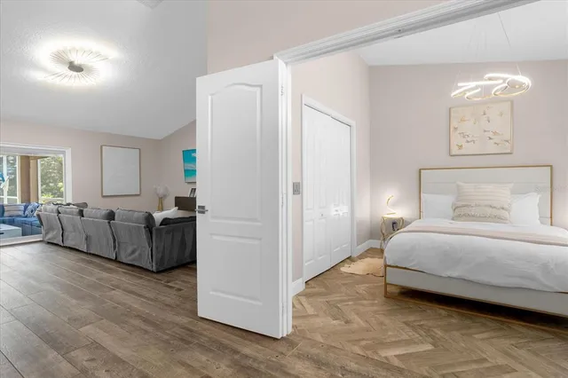 a bedroom with furniture and a lamp