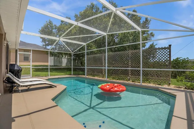 a view of a backyard with a table and chair