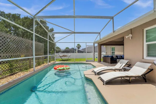a outdoor space with swimming pool and furniture