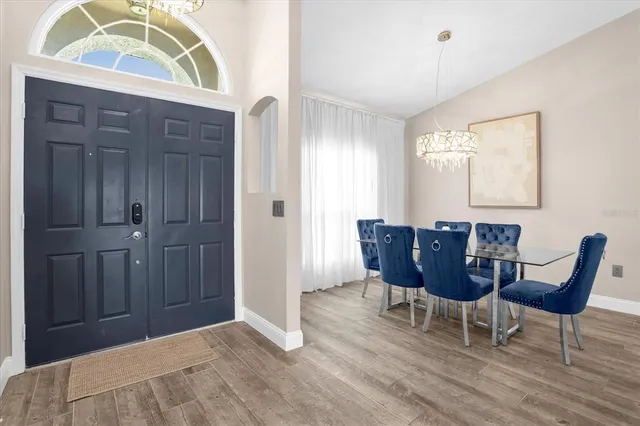 a view of a dining room with furniture and window