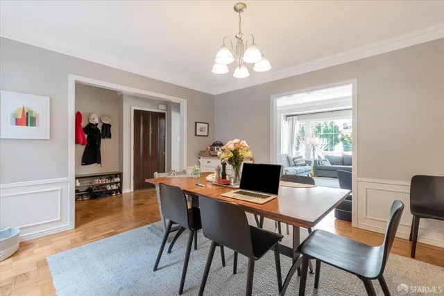 a bathroom with a granite countertop toilet sink and mirror