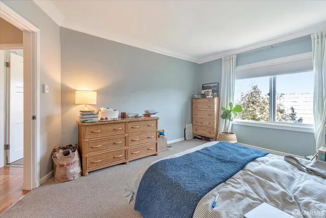 a large kitchen with granite countertop a stove a sink and a refrigerator