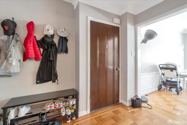 a kitchen with stainless steel appliances granite countertop a refrigerator a sink dishwasher with a dining table and chairs