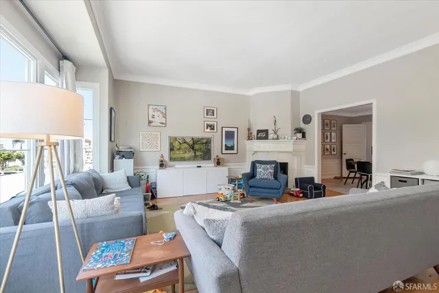 a view of a dining room with furniture and chandelier