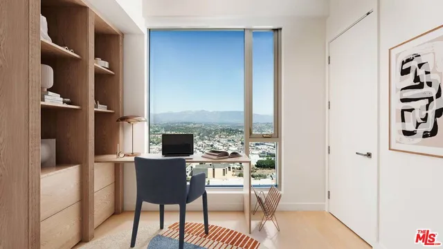 a dining room with furniture and a floor to ceiling window