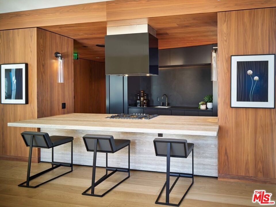 151 South Olive Street, Unit PH4501 Los Angeles, CA 90012 - Photo 10 of 14 a kitchen with a table and chairs