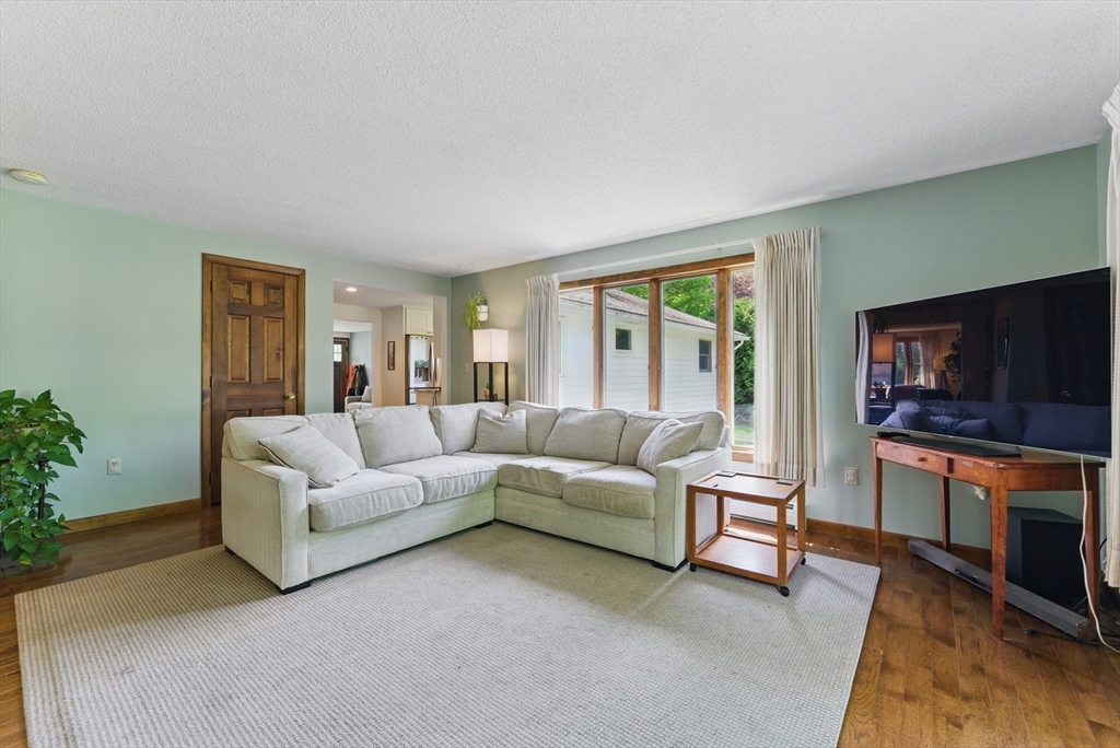 19 Straits Road Hatfield, MA 01038 - Photo 17 of 42 a living room with furniture and a flat screen tv