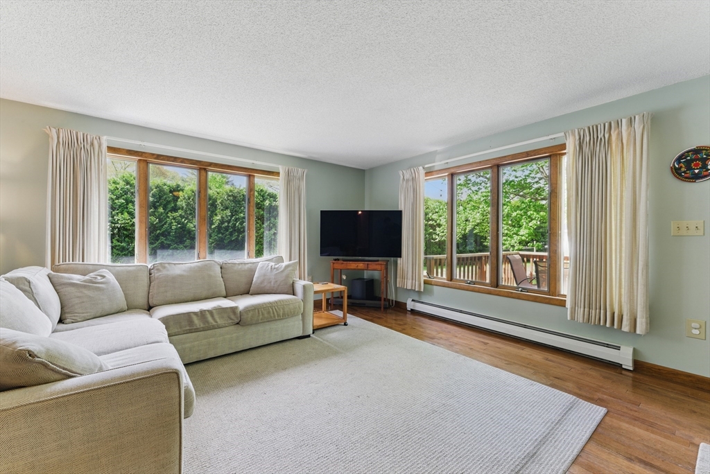 19 Straits Road Hatfield, MA 01038 - Photo 18 of 42 a living room with furniture and a flat screen tv