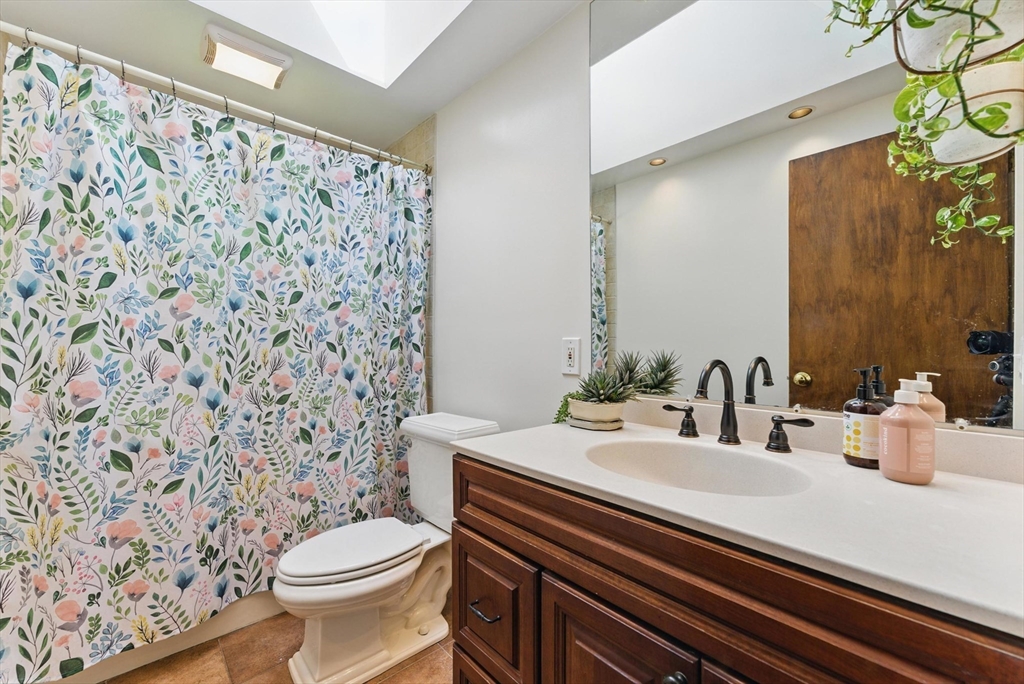 19 Straits Road Hatfield, MA 01038 - Photo 22 of 42 a bathroom with a sink a toilet and shower curtain