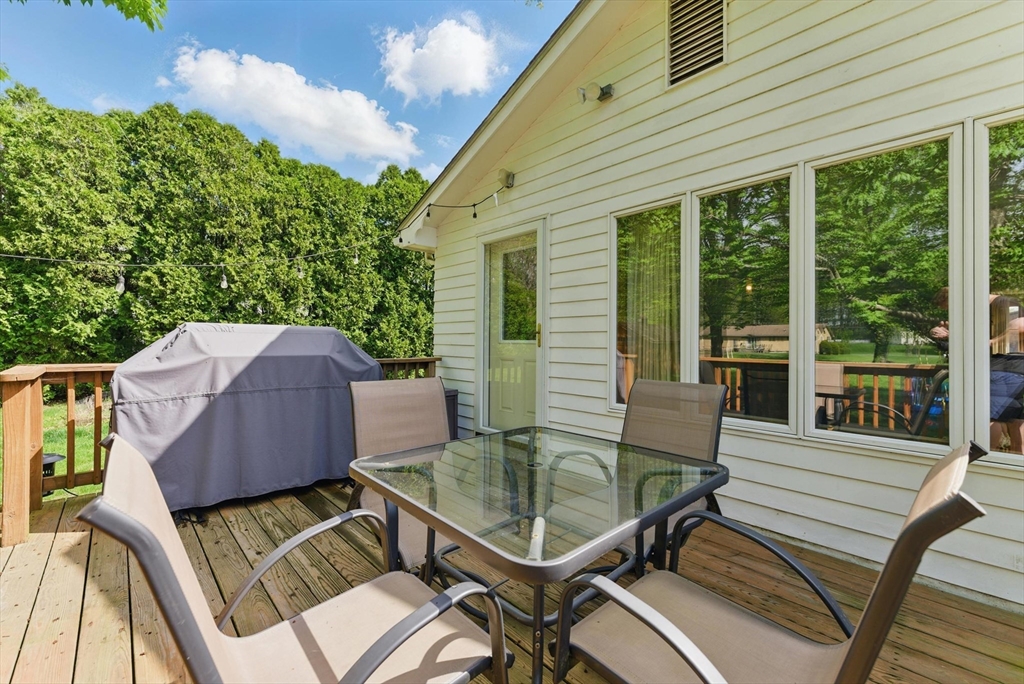 19 Straits Road Hatfield, MA 01038 - Photo 32 of 42 a view of a patio with table and chairs with wooden floor and fence
