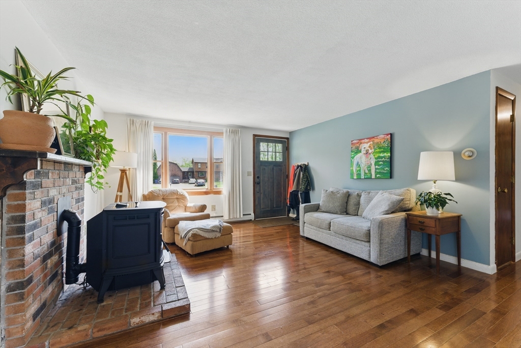 19 Straits Road Hatfield, MA 01038 - Photo 6 of 42 a living room with furniture and a fireplace