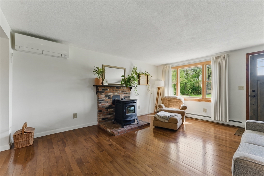 19 Straits Road Hatfield, MA 01038 - Photo 7 of 42 a living room with furniture and a wooden floor