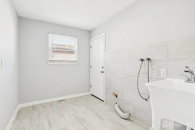 a bathroom with a glass shower door