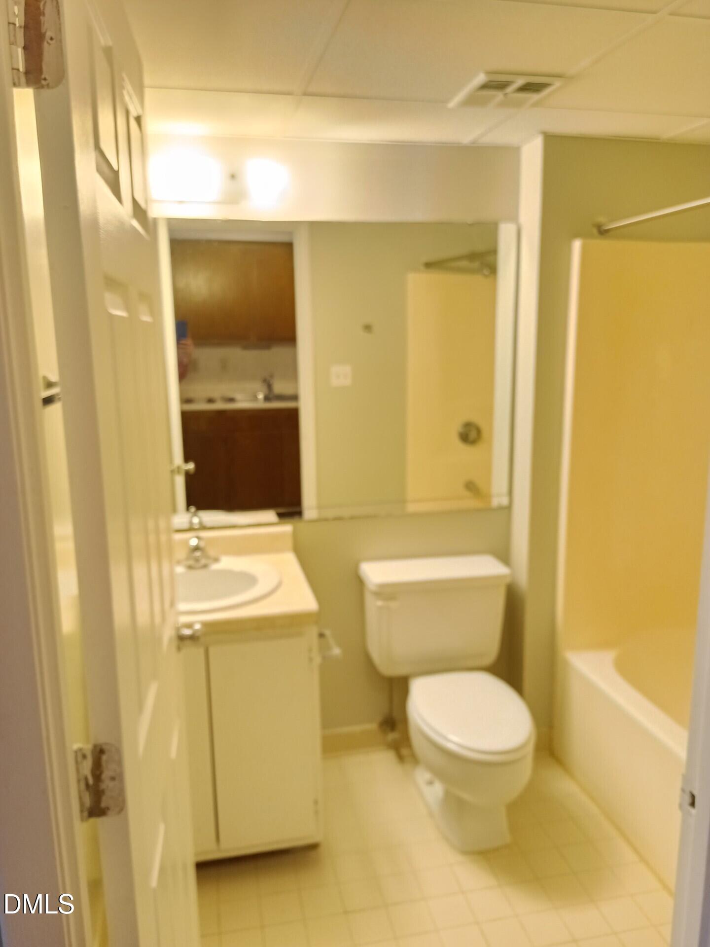4700 Westgrove Street, Unit 101 Raleigh, NC 27606 - Photo 5 of 5 a bathroom with a toilet a sink and shower