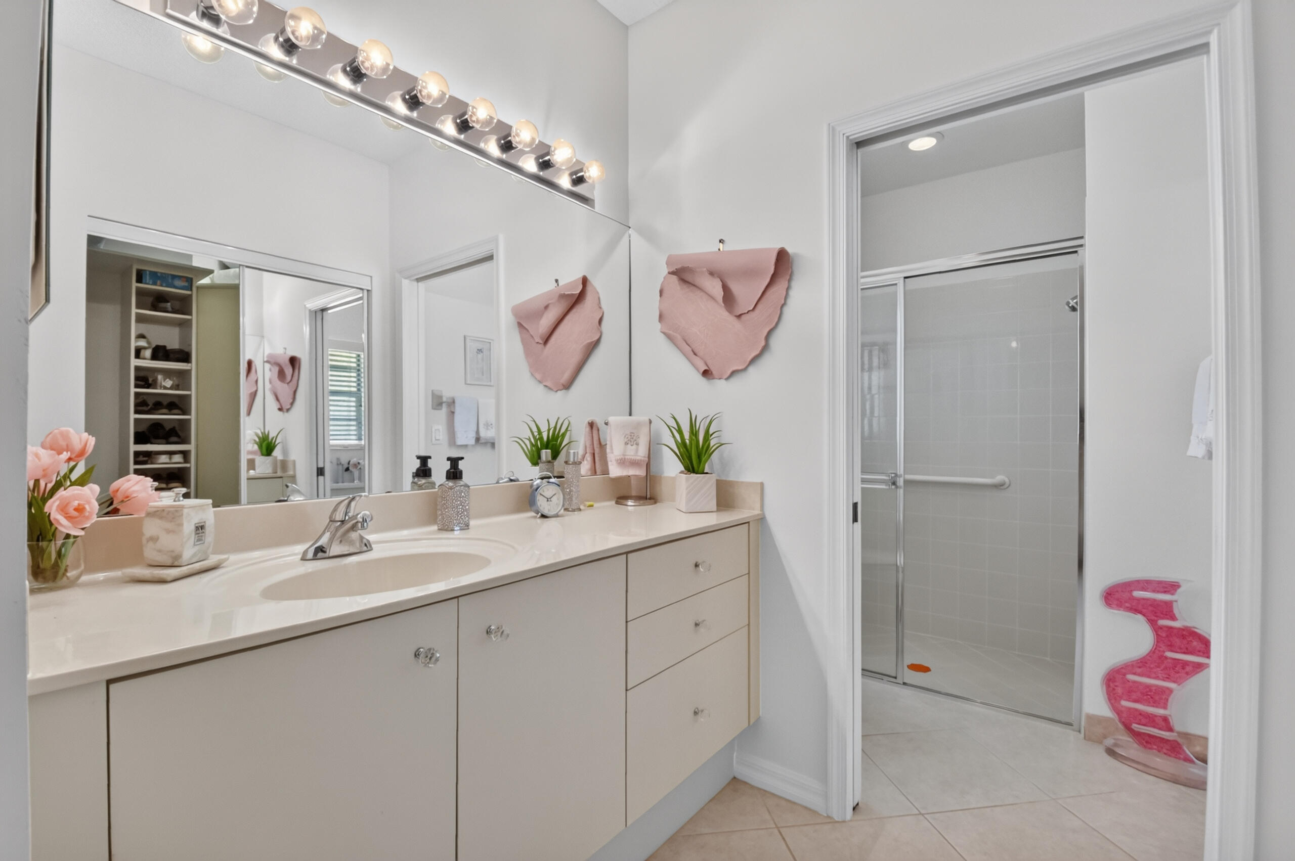 15340 Floral Club Road Delray Beach, FL 33484 - Photo 25 of 42 a bathroom with a sink and a mirror